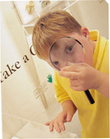 Image of boy with magnifying glass