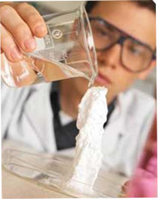 Image of a scientist pouring a liquid