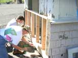 Image of men working on guard shack