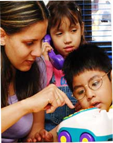 Image of teacher and 2 kids playing with toy