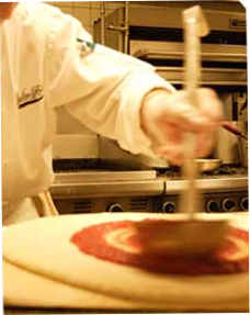 Image of pizza being made