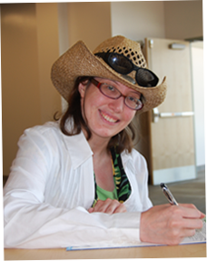 Image of female with hat writing