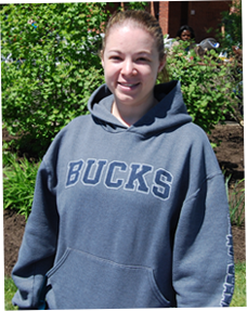 Image of female wearing Bucks sweatshirt