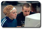 Image of 2 people looking at a computer