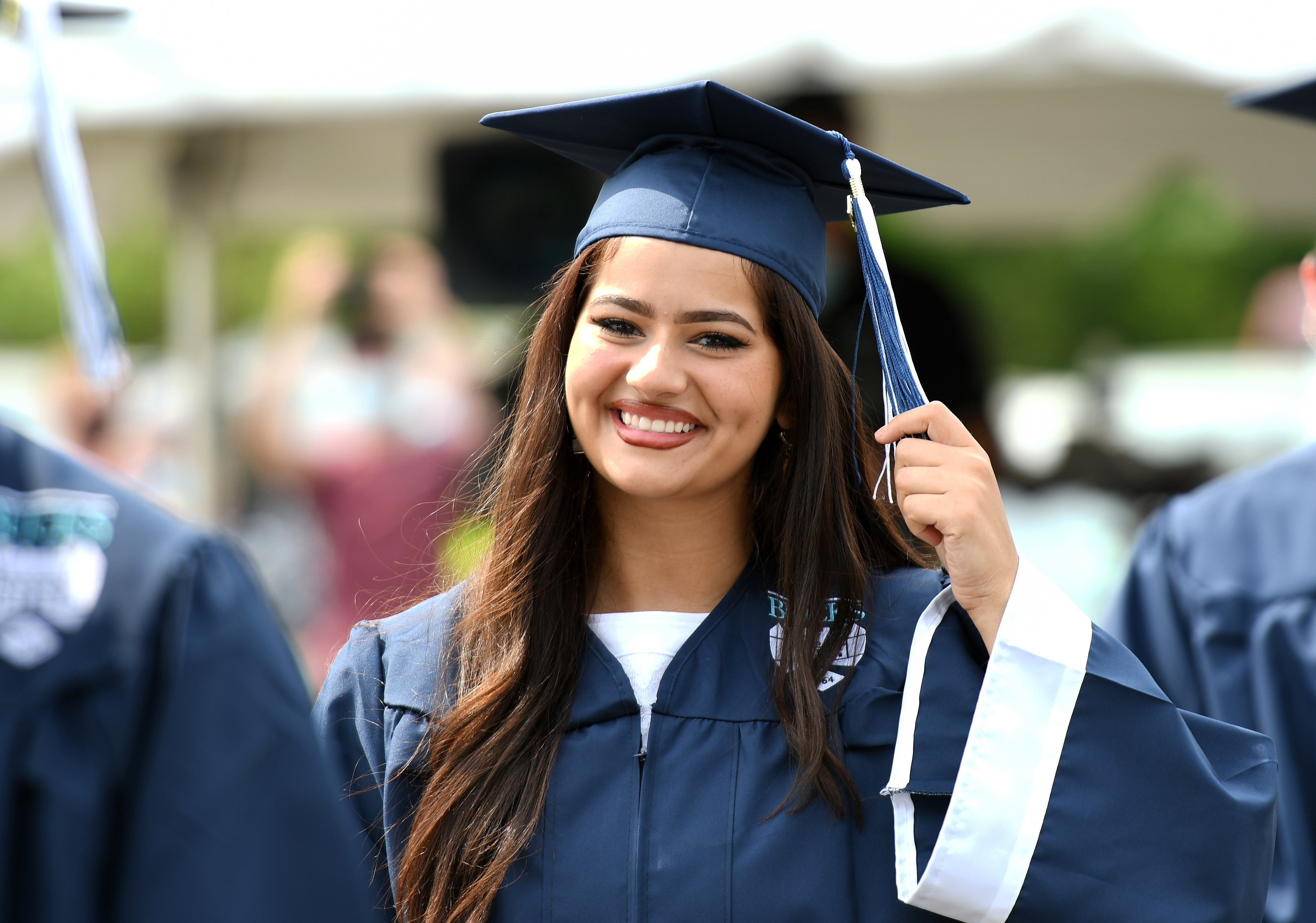 girl smiling in cap and gown