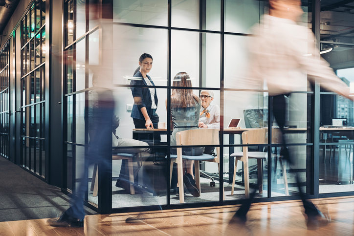 people walking in an office