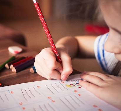 Child drawing on paper