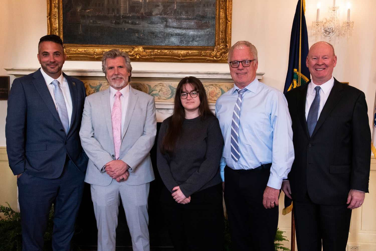 alumni honorees standing with Bucks County Community College President.
