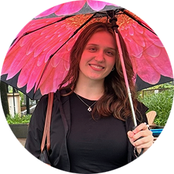 Circular image of woman holding bright pink umbrella