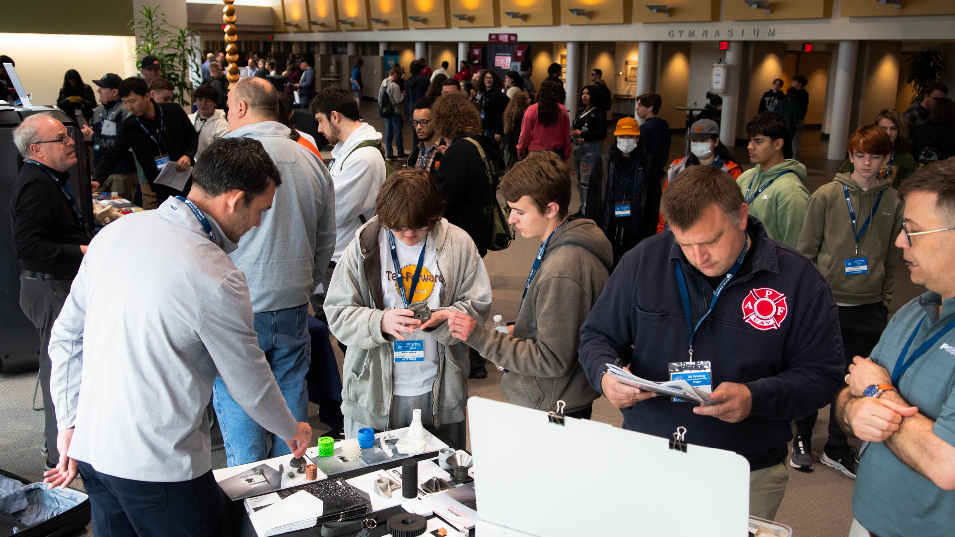 3D Printing Expo vendor talking with attendees