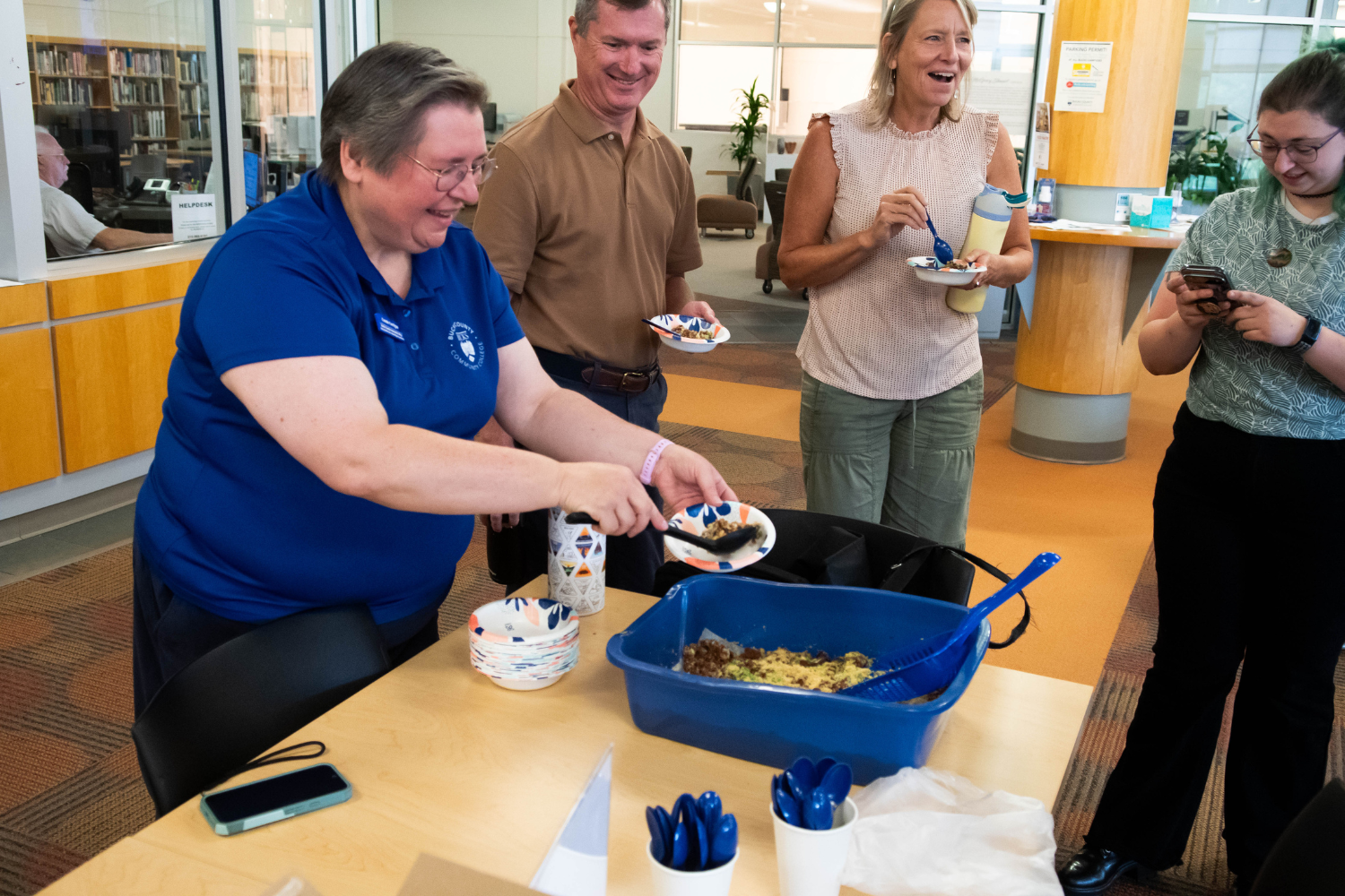 Dean of health sciences serving a pet themed treat