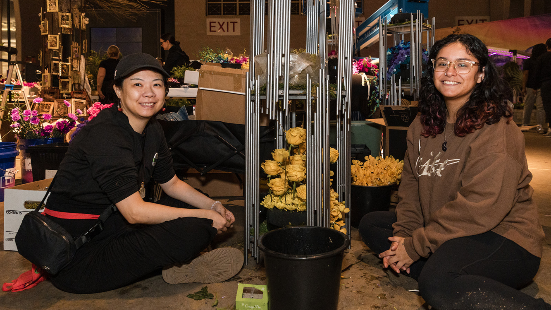 Floral Design Program students and instructor from Bucks County Community College working on a floral arrangement