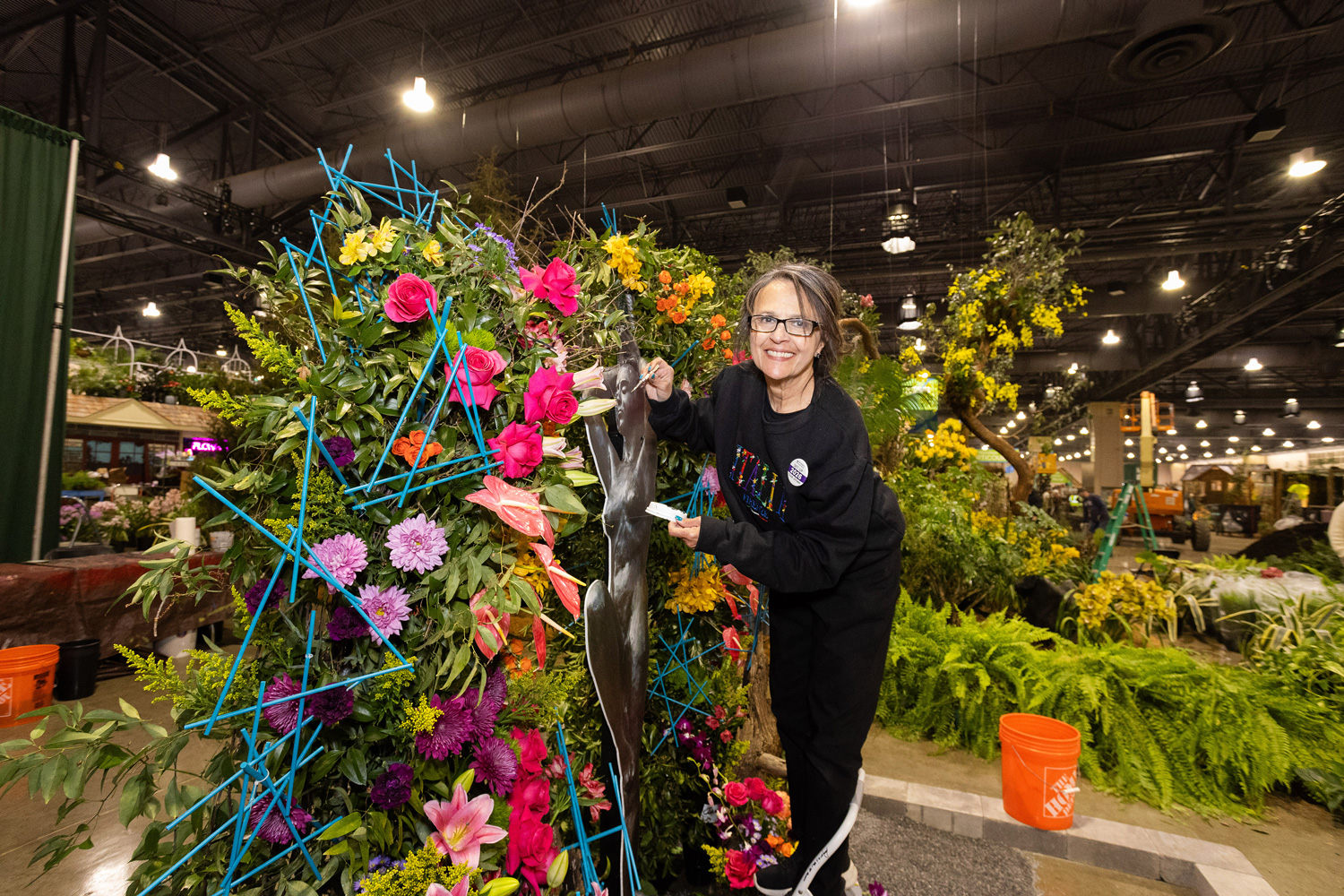 Certified Flower Designer Amparito Arriaga preps flower exhibition
