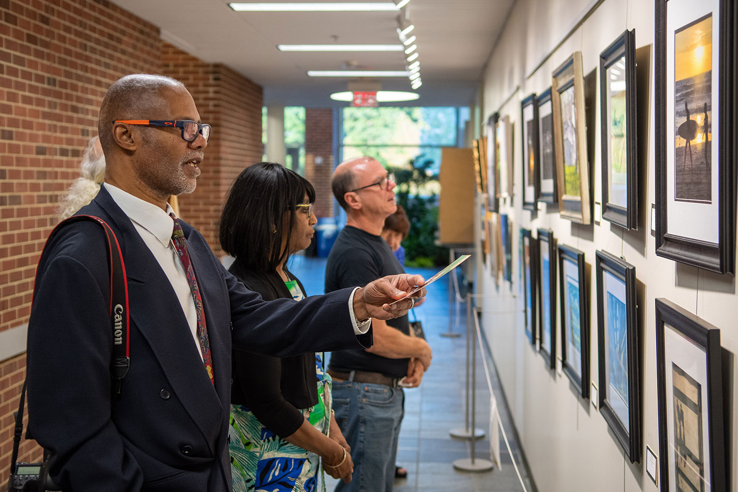 Male spectator views artwork in the Gallery at Lower Bucks