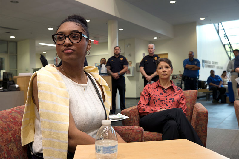 Youth Commissioner of Philadelphia Makayla Myers listens to speakers at the opening reception for the “Souls Shot Portrait Project”