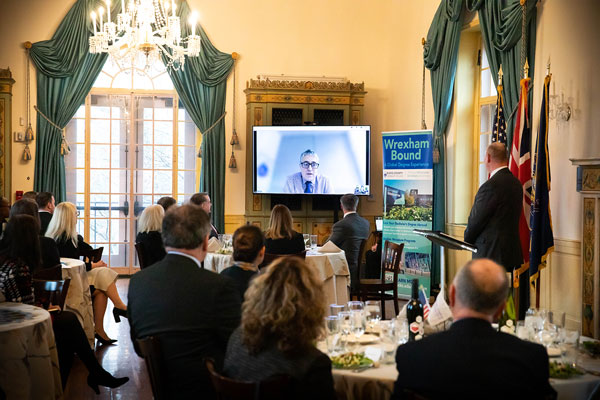 Person on tv screen in room