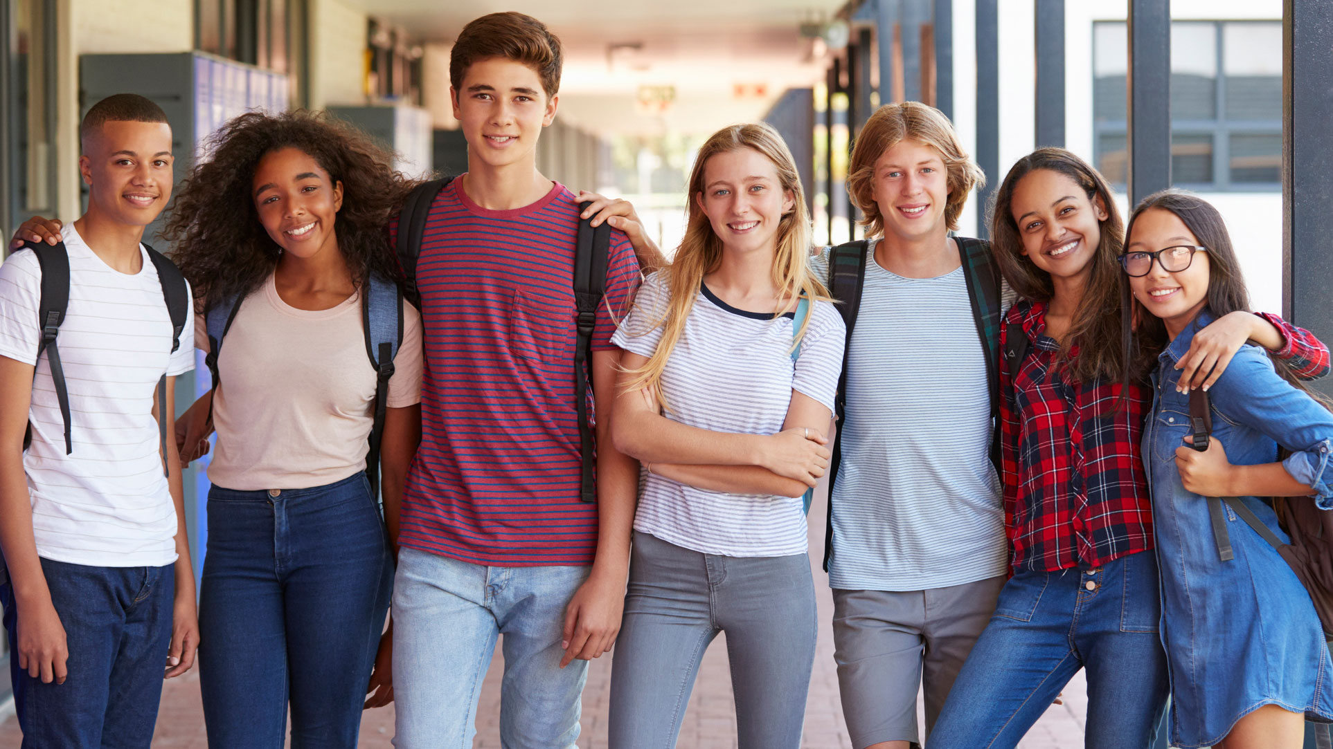 Teenage classmates standing together