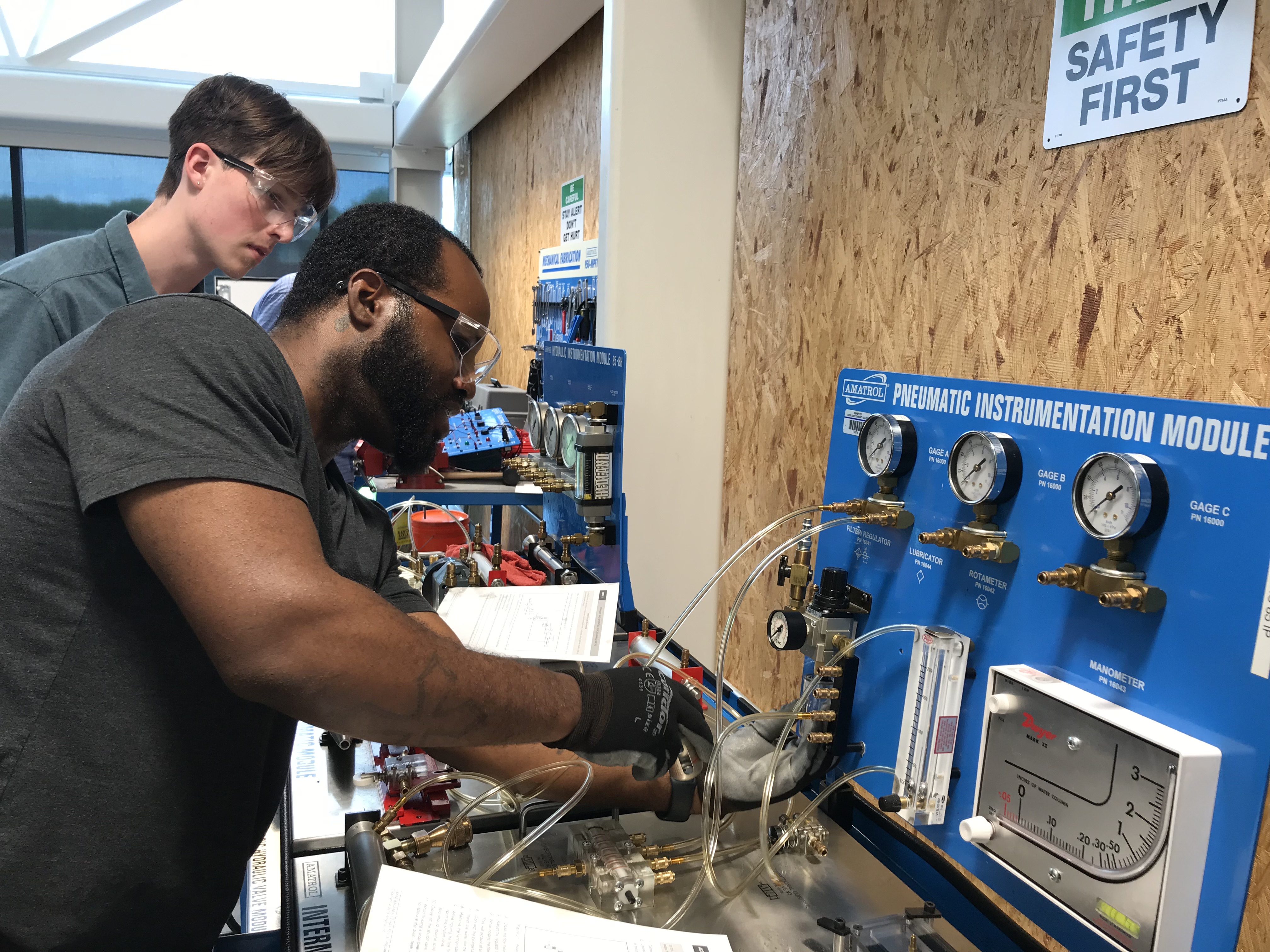 Male student works with equipment