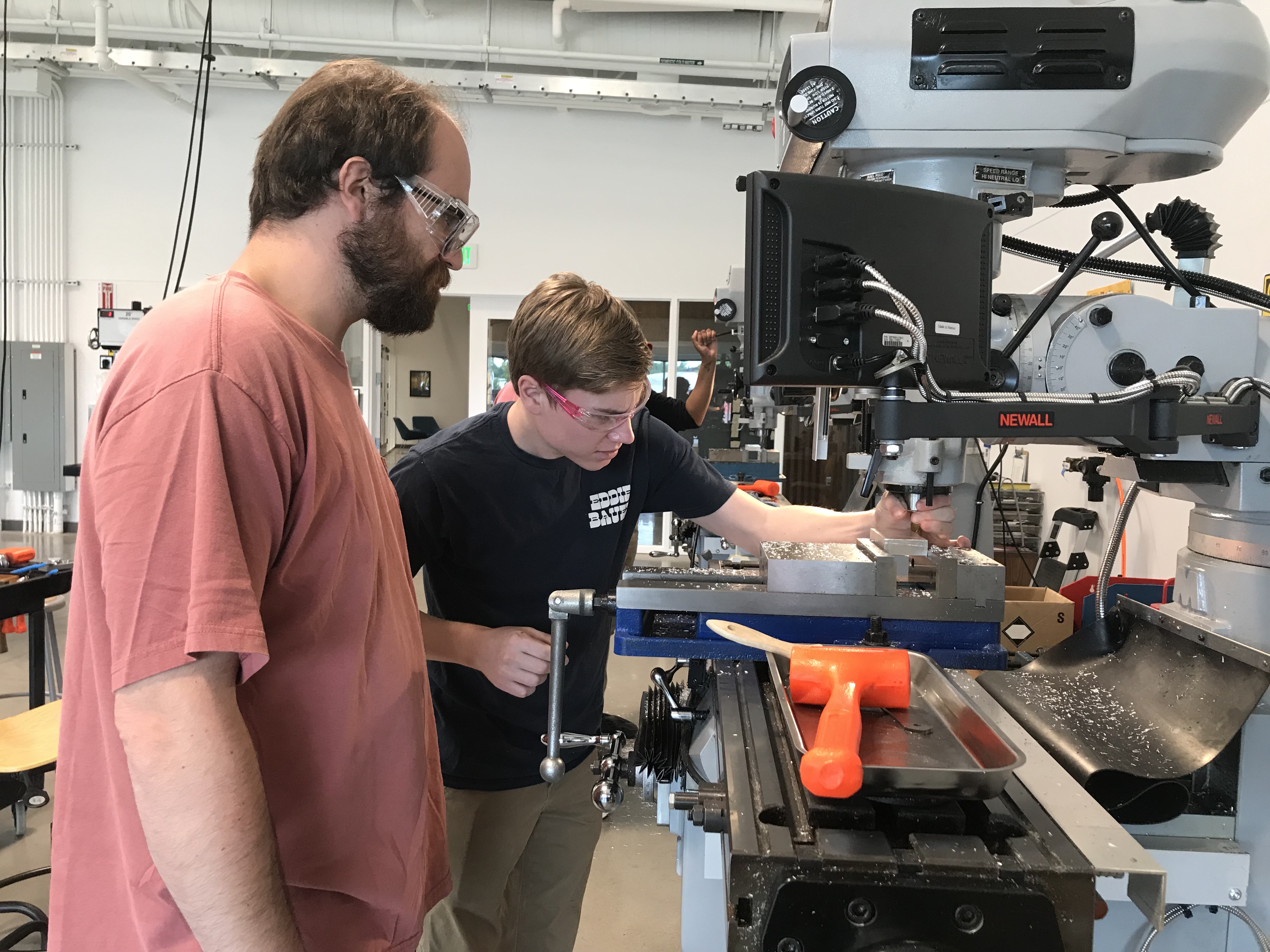 Male student watching over peer
